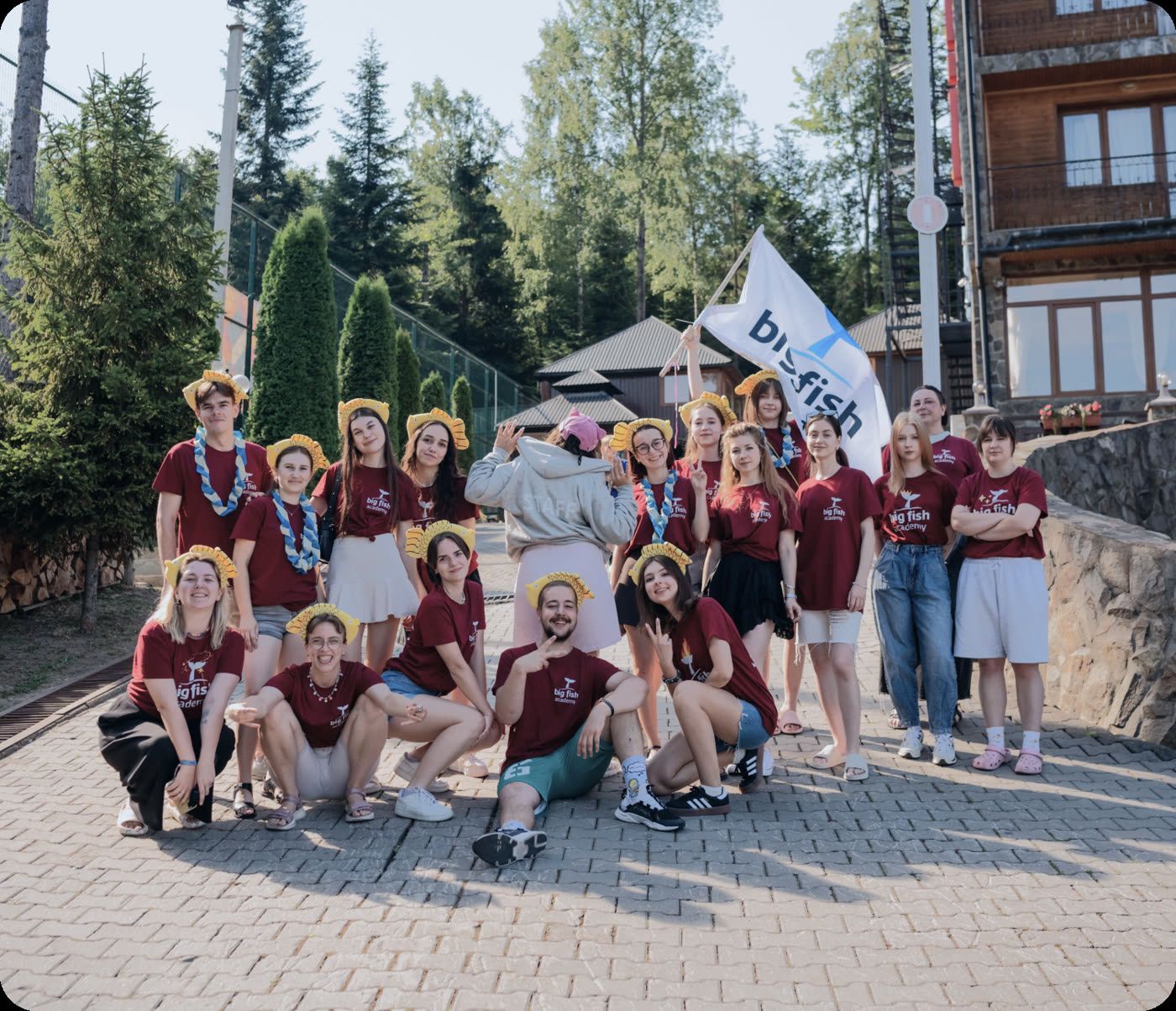 Big Fish Camp participants with the camp flag